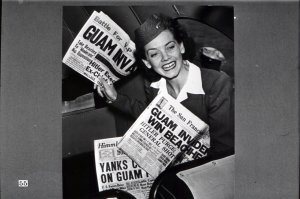 This picture might lead you to believe that the young lady actually is selling newspapers. She isn't. The story behind it is that stewardess