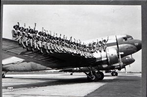 And the ranks of stewardesses continue to grow! This picture shows 30 brand-new stewardesses on the wing of a Mainliner, representing the la