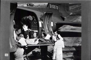 Home they come - back from combat - and with the flight nurse ever vigilant as to their welfare.