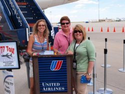 (Left) United workers and their families get the opportunity to take a guided tour of United’s Boeing 777 aircraft, after they get their pas