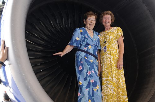 (Left to Right) Retired flight attendants and UAHF volunteers Phyllis Jack and Janet Meyer model uniforms worn by United crews who served th