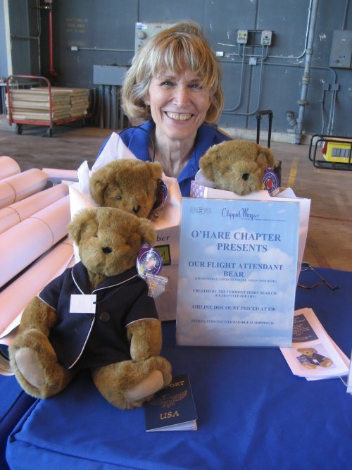 Jan Brown is holding a flight attendant bear that was sold as a fundraiser for Clipped Wings®
