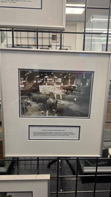 Framed archival photograph of a hangar floor