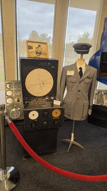 Link Trainer instrument panel with a pilot uniform