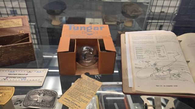 Tungar bulb, belt buckles and a manual