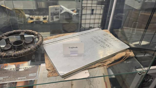 Flight logbook and a wheel-style yoke